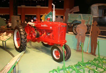 Tractor Farmer machine at the museum - black, red, wheels, tractor