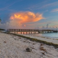 Beautiful Beach and Pier at Sunset