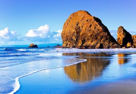 Rock on Beach - clouds, large, water, hard, blue, rock, smooth, ocean, reflection, daylight, sand, white, nature, day, wave, sky