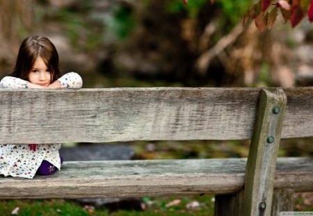 sweetheart kneeling on a bench