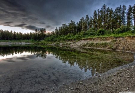 Calm Before the Storm - blue, grass, forest, light, reflection, dark, shore, dirt, lake, sky, clouds, trees, water, stones, nature, green, day