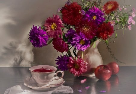 Still Life - beauty, cup of tea, photography, still life, purple, pretty, petals, tea time, purple flowers, red flowers, tea, apples, lovely, vase, cup, nature, beautiful, red, flowers