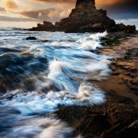 ocean waves on a rocky shore