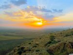 sunset over a huge valley