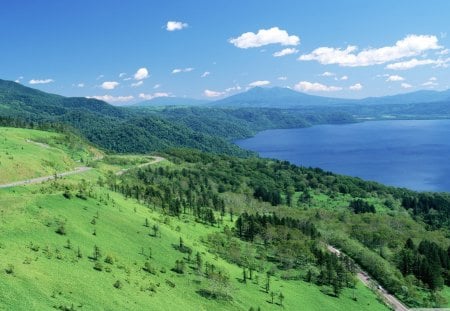 glorious summer day in japan - mountain, clouds, grass, road, sea, coast