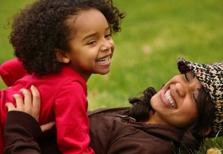 Black Mother - brown, together, grass, black, happiness, smile, nature, red, green, mother