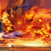 Fiery Clouds over a Sunset Field