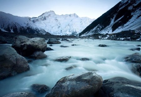 a melting glacier in new zealand - melting, river, glacier, stones, mountains