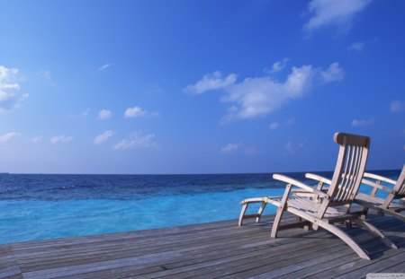 chairs on a deck looking to the sea - chairs, sea, deck, sky