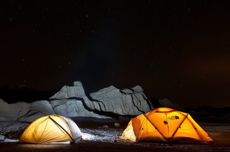 isolation - sratrs, tents, boulder, lights