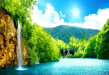 Waterfalls place - dazzling, sun, waterfall, reflection, river, sunny, rock, harmony, lake, falling, mountain, light, place, nature, forest, beautiful, nice, sunshine, greenery, water, clear, rocks, crystal, fall, emerald, green, rays, sunlight, falls, waterfalls, summer, lovely, blue