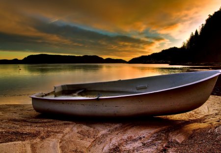 Abandoned Boat - beauty, sky, trees, peaceful, water, sunset, rocks, view, reflection, clouds, tree, boat, lake, adandoned, landscape, boats, sunlight, lovely, nature, beautiful, splendor