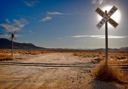 railroad crossing in the middle of nowhere - crossing, sun, tracks, road, country