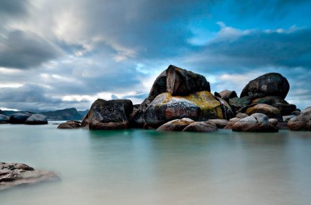 boulders on a beach - beach, bay, boulders, clouds