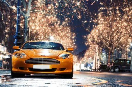 aston martin on a street in christmas - street, christmas, car, lights, orange