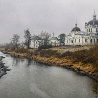 church near a river on a rainy day