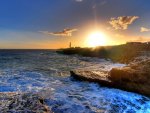 sunrise over lighthouse on the point