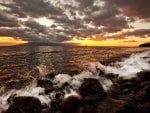 sunset over a rocky shore