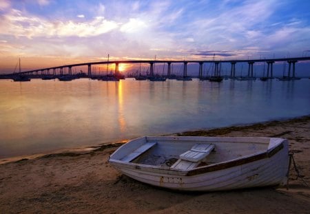 Lovely Sunset - beauty, sky, beach, ocean waves, sailboats, peaceful, sunset, view, clouds, bridge, sand, boat, ocean, boats, sunlight, sailing, lovely, waves, nature, beautiful, splendor, sailboat, colors, sunrise, sea