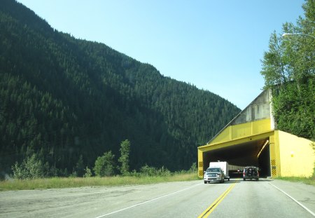 driving through the tunnel - sky, trees, truck, mountains, iron, tunnel, road, yellow, blue, green