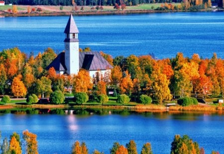 Clock tower on the riverbank