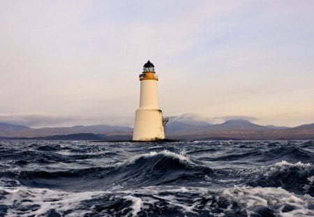 lighthouse in rough seas - clouds, lighthouse, waves, sea, mountains