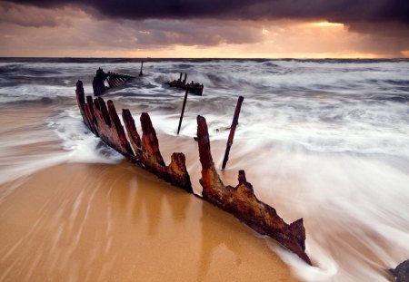 rusty ship skelaton - clouds, ship wreck, beach, waves, skelaton