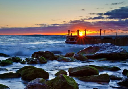 Ocean Waves - blue, amazing, splendor, sunrise, sunrays, view, ocean waves, sky, sun, clouds, sunlight, beautiful, sea, beauty, lovely, ocean, pier, nature, sunset, rays, waves, peaceful, rocks