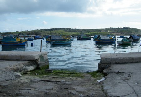 Malta Marsaxlokk - boats, rock, sea, grass