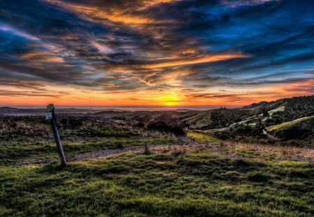 Lovely Sunset - road, beautiful, amazing, grass, view, nature, sunset, colorful, path, rays, landscape, valley, beauty, pathway, sun, peaceful, sky, sunrays, sunlight, clouds, lovely, splendor, colors, green