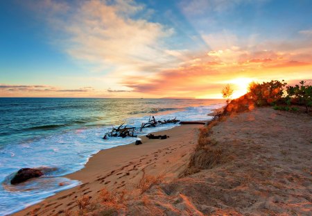 Footprints - ocean waves, sun, sunset, shine, coast, view, reflection, evening, sunrays, sunbeams, light, waves, nature, glow, beautiful, sea, nice, beauty, sky, beach, footprints, peaceful, rocks, clouds, orange, sand, rays, ocean, sunlight, summer, shore, lovely, splendor