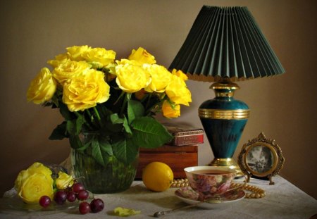 Still Life - roses, yellow, romantic, romance, lamp, photo, flowers, yellow rose, box, fruits, vase, for you, cup of tea, beautiful, photography, beauty, tea, lovely, with love, tea time, petals, bouquet, stil life, grapes, yellow roses, nature, rose, cup, lemon