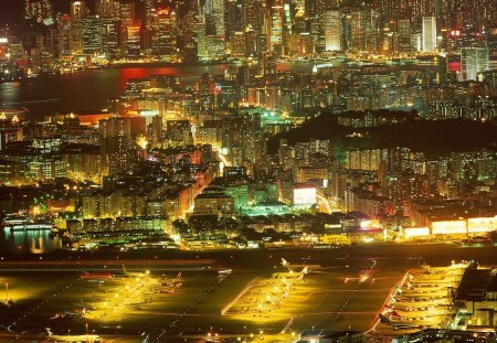 the old kai tak airport in hong kong - airport, city, skyscrapers, lights, planes