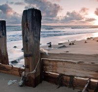 old pylons on a beach