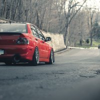 Red Car on autumn road