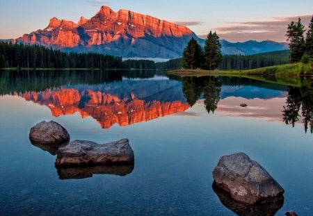 Sunrise lake - mirrored, stones, sundown, serenity, peaceful, shore, lake, peaks, reflection, slopes, lakeshore, trees, sunset, nature, sunrise, calm