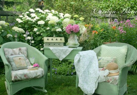 beautiful spot in the garden - flowers, pillows, table, still life, garden furniture