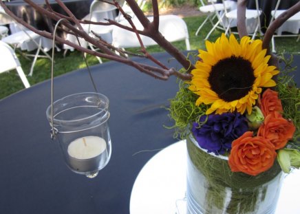 An evening that promisesâ™¥ - sunflower, special, roses, yellow, forever, arrangement, orange, green, purple flowers, love, fresh, candle, light, fashion, entertainment, bright, precious, floral, event, sweet