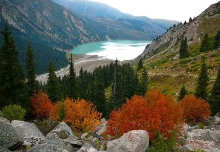 Calm mountain lake - calm, summer, reflection, mountain, shore, view, lake, nice, trees, beautiful, lovely, stones, lakeshore, fall, slopes, colorful, nature, autumn, rocks