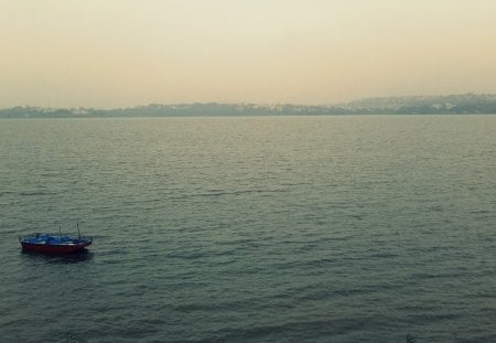 Alone - mansoon, sea, rain, boat