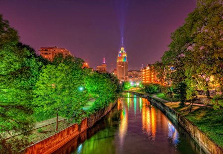 Fiesta life - pretty, fun, entertainment, night, reflection, shore, riverbank, nice, sky, clouds, trees, fiesta, water, beautiful, mirrored, city, lovely, buildings, life, river, big, nature, lights, dusk