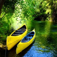 Canoes in calm lake