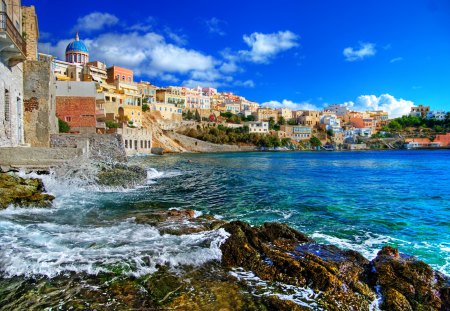 Greece - colorful, coast, view, summer time, romance, sunny, building, landscape, greece, buildings, waves, nature, romantic, beautiful, sea, beauty, sky, peaceful, rocks, clouds, architecture, house, ocean, houses, sea waves, seascape, summer, lovely, village, town, church, blue, splendor, city, colors