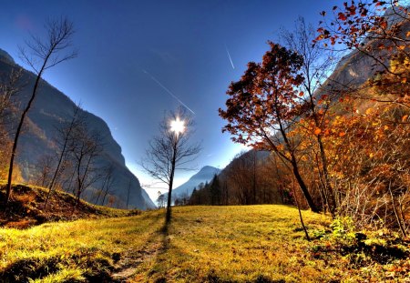 Mountain sun - pretty, sunny, grass, light, leaves, mountain, cliffs, nice, sky, sun, clouds, beautiful, colors, lovely, fall, slopes, glow, colorful, nature, autumn, bright, foliage, shine