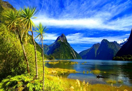 Beautiful landscape - nice, sky, riverbank, stream, colorful, creek, calm, yellow, reflection, calmness, river, clouds, lake, mountain, landscape, palms, shore, peaks, lovely, slopes, nature, glow, beautiful