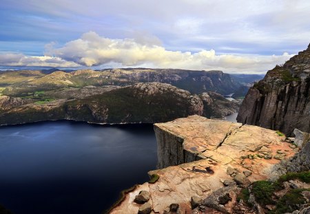 what a view - lake, clouds, blue sky, mountains, grass, rocks, cliffs