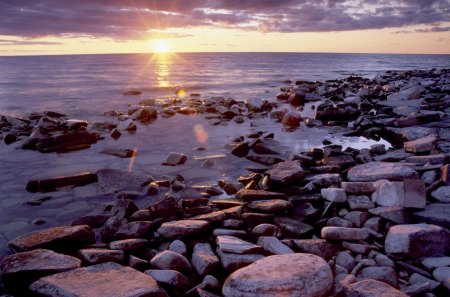 Touch - touch, beach, ocean, sunset, pebble, sun, sky, rocks, bay