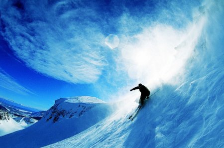 skier - skiis, clouds, person, snow, blue sky, mountains, sun