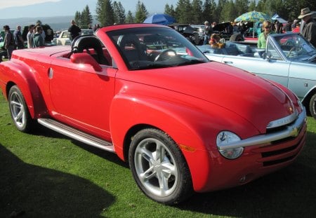 2006 Chevrolet at the radium  - trees, tires, red, green, photography, grass, chevrolet