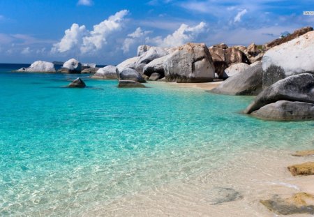 Large Rocks at the Shoreline - beach, sky, daylight, day, water, shore, clear, nature, white, blue, clouds, rock, sand